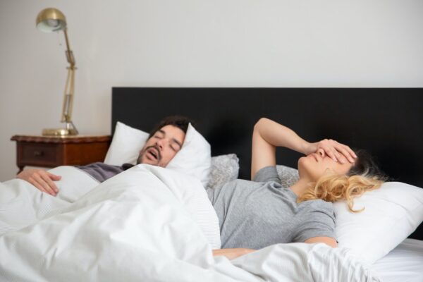 Man Sleeping Beside a Woman