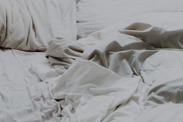 white pillows and bed comforter